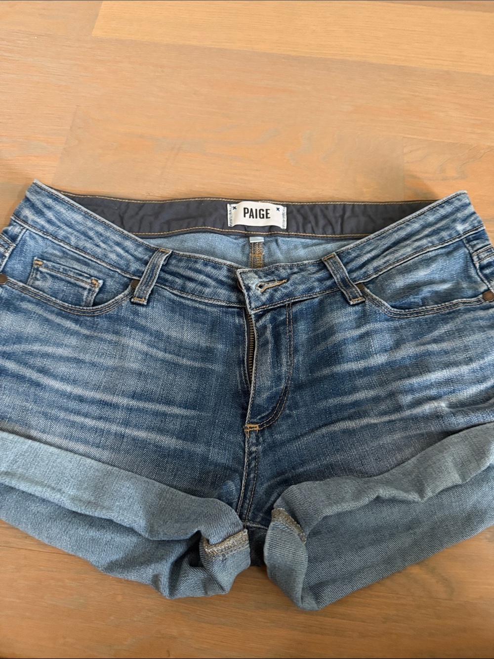 PAIGE Rolled Cuff Distressed Denim Shorts in Faded Blue